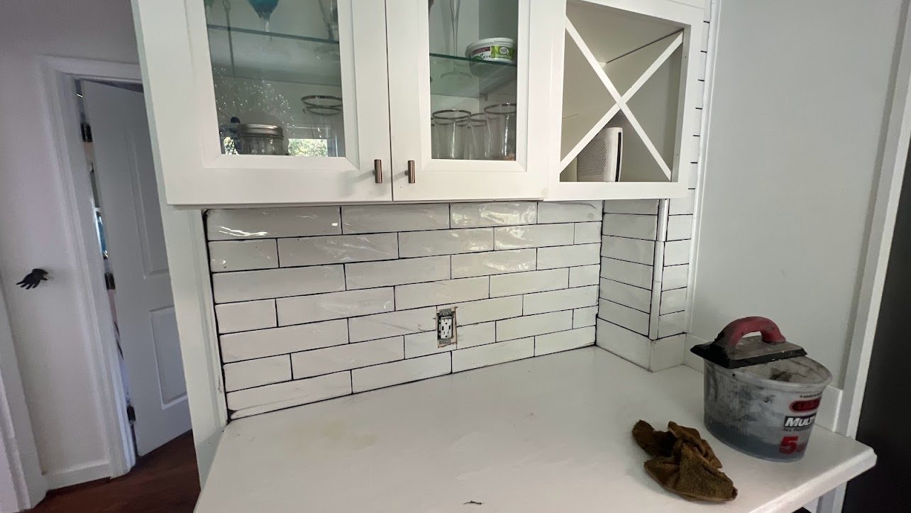 Detailed white tile backsplash