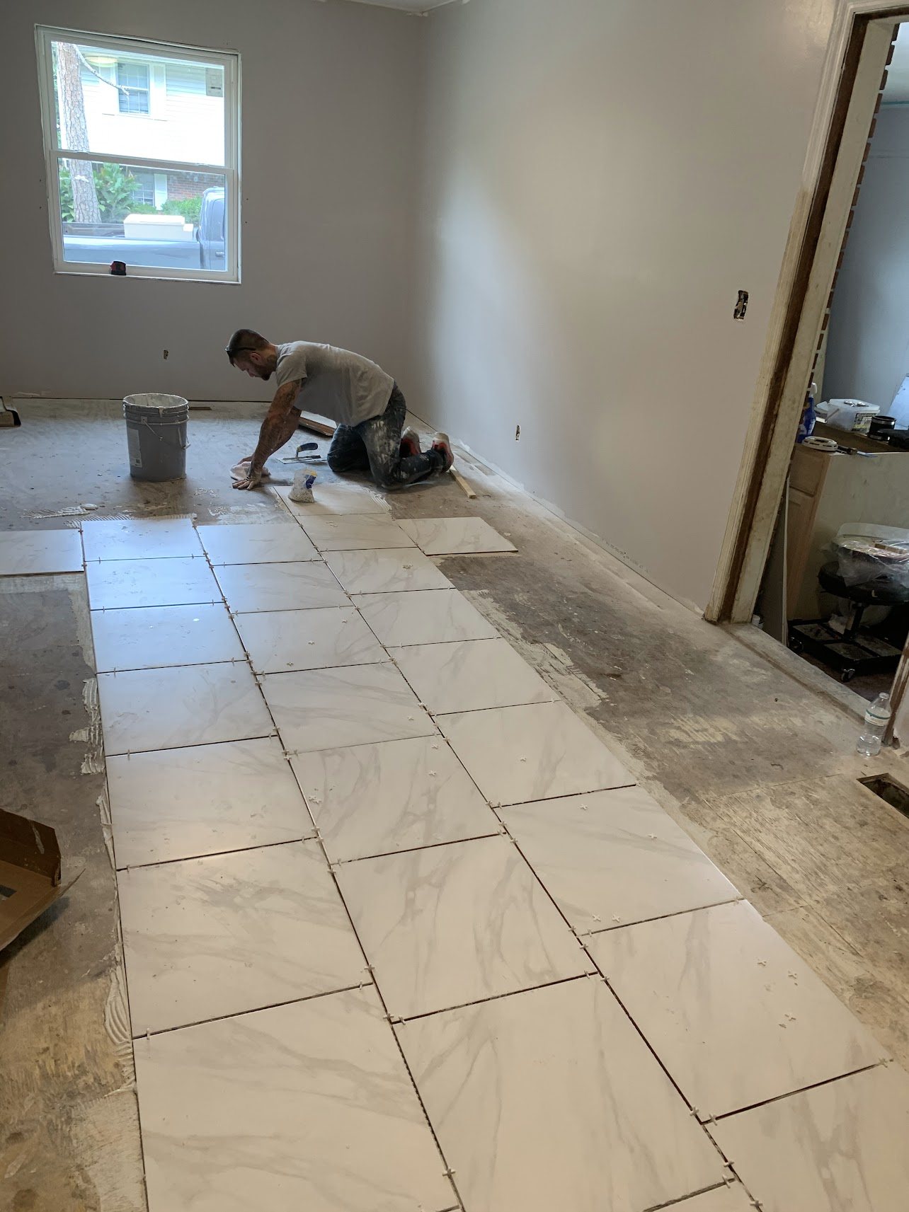 Tile flooring installation in progress
