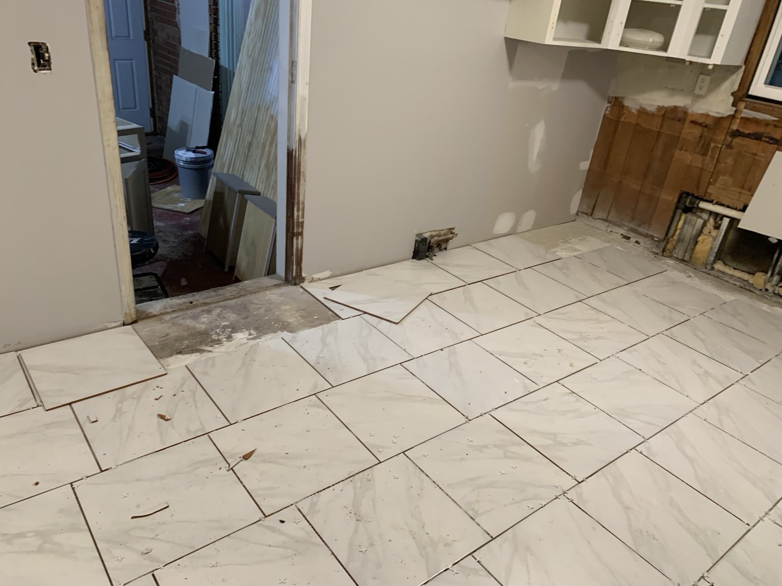 Large format tile floor installation